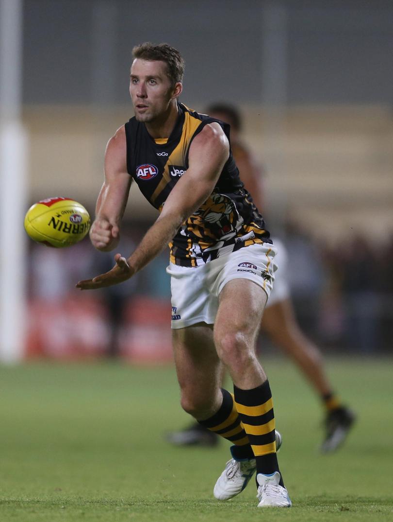 Orren Stephenson passes the ball during the AFL exhibition match between the Richmond Tigers and the Indigenous All-Stars.