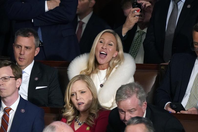 Rep. Majorie Taylor Greene, R-Ga., center, listens and reacts as President Joe Biden delivers his State of the Union speech to a joint session of Congress, at the Capitol in Washington, Tuesday, Feb. 7, 2023. (AP Photo/J. Scott Applewhite)