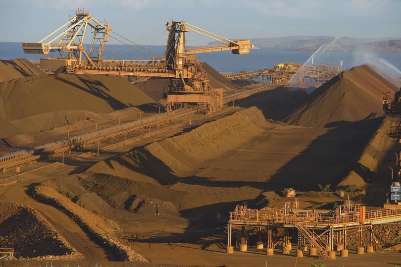 KARRATHA, AUSTRALIA - JUNE 02:  Rio Tinto Iron Ore Parker Point loading facility reclaimer is seen as part of the mining activities of British-Australian mining and resources company Rio Tinto Iron Ore, at Dampier in Western Australia. The multinational has recently signed Indigenous Land Use Agreements with five traditional Aboriginal owner communities in the Pilbara region of Western Australia. The agreements provide Rio Tinto with resource access mainly for iron ore mining expansion, whilst compensating local communities by providing jobs, business start up assistance and ongoing financial advice to improve the wellbeing of local Aboriginals for the next 40 years. Rio's Iron Ore group is the largest private employer of Aboriginal people in Australia, currently employing 891 people of Aboriginal descent, with over AUD250 million of contracts awarded to Pilbara Aboriginal businesses over 2009 and 2010. (Photo by Aaron Bunch/Getty Images)