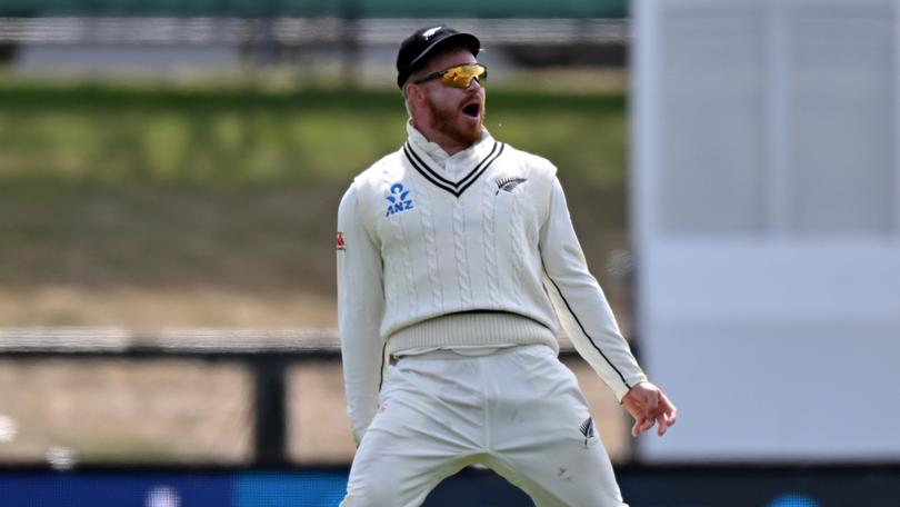 Glenn Phillips celebrates after taking a catch to dismiss Marnus Labuschagne.