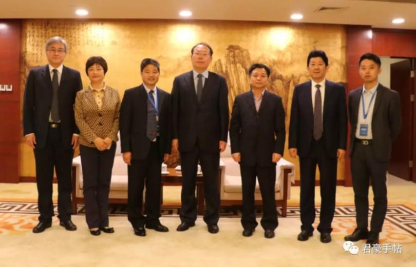 Jin Zengjiang, far right, pictured with Vice Governor of the Anhui Provincial Government Zhou Xian, centre.