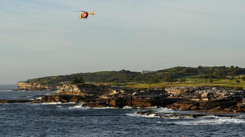 Jet skis, rescue boats and a helicopter are searching for a swimmer missing in waters off Sydney. 