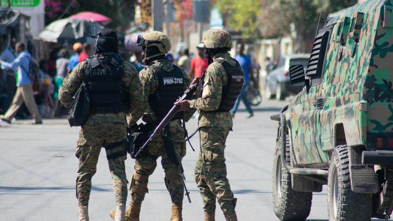 Haitian police officers deploy in Port-au-Prince as gang violence escalates.