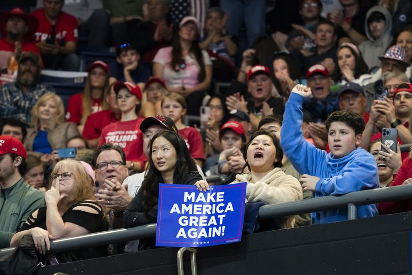 Attendees cheer during a rally for former President Donald Trump in Rome, Ga. on March 9, 2024. 