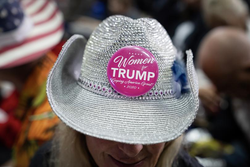  An attendee wearing a “Women for Trump” button on her hat.