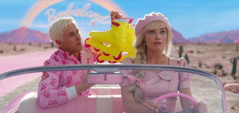 This image released by Warner Bros. Pictures shows Ryan Gosling, left, and Margot Robbie in a scene from "Barbie." (Warner Bros. Pictures via AP)