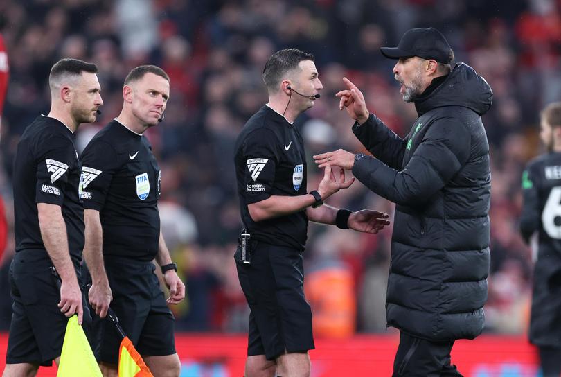 Jurgen Klopp arguing with referee Michael Oliver after the match.