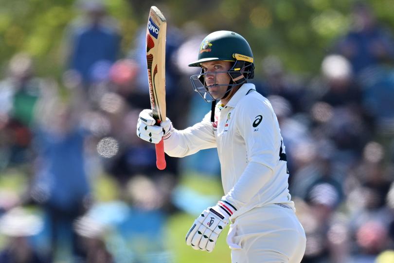 Alex Carey of Australia celebrates his half century.