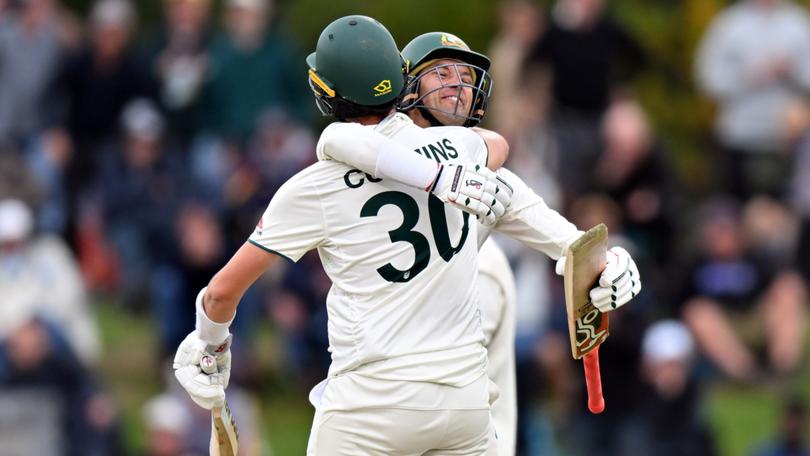 Pat Cummins and Alex Carey celebrate their win.