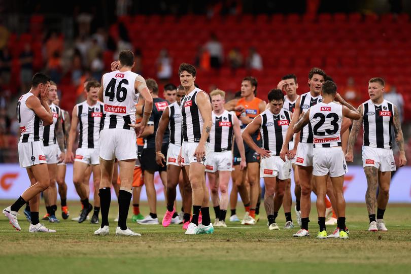 SYDNEY, AUSTRALIA - MARCH 09: Magpies players look dejected after losing the AFL Opening Round match between Greater Western Sydney Giants and Collingwood Magpies at GIANTS Stadium, on March 09, 2024, in Sydney, Australia. (Photo by Cameron Spencer/Getty Images)