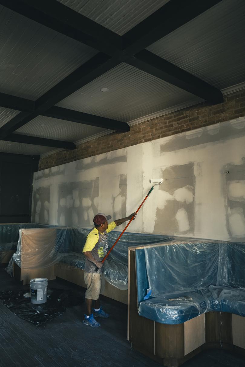 A worker paints the walls of Le Rve, Brownsvilles first French bistro, in Brownsville, Texas, on Feb. 22, 2024, a city near SpaceXs launch site and the recipient of millions of dollars from the Musk Foundation. (Meridith Kohut/The New York Times)
