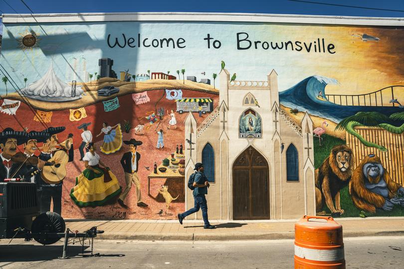 A new mural in Brownsville’s downtown on Feb. 21, 2024, depicts the city's old landmarks the cathedral, the zoo, and the Gulf of Mexico beach alongside a new one: SpaceXs rocket complex. (Meridith Kohut/The New York Times)
