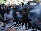 Palestinians prepare food on the first day of Ramadan in the south of the Gaza Strip. (EPA PHOTO)