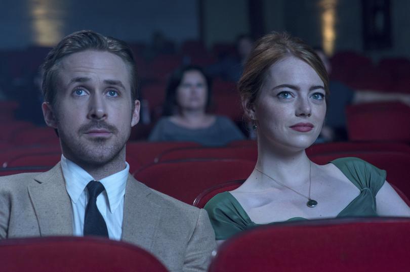 This image released by Lionsgate shows Ryan Gosling, left, and Emma Stone in a scene from, "La La Land." (Dale Robinette/Lionsgate via AP)