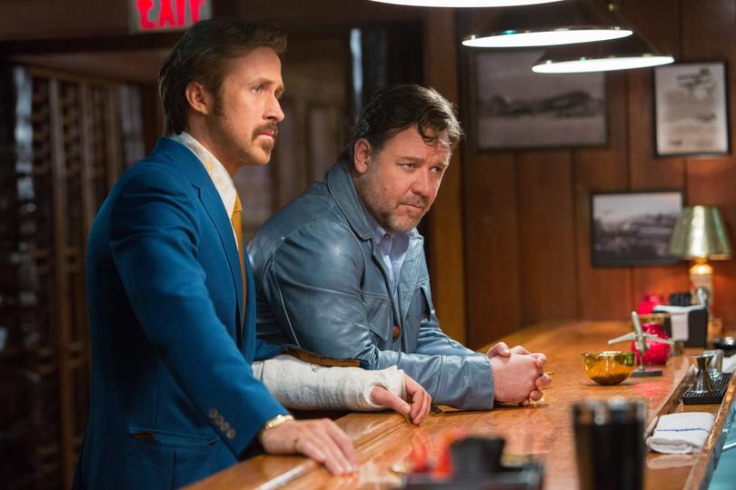 This image released by Warner Bros. Entertainment shows Ryan Gosling, left, and Russell Crowe in a scene from "The Nice Guys." (Daniel McFadden/Warner Bros. Entertainment via AP)