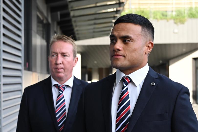 Roosters prop Spencer Leniu arriving with head coach Trent Robinson ahead of the NRL judiciary hearing in Sydney on Monday. He was banned for eight weeks over his racial slur towards Ezra Mam.