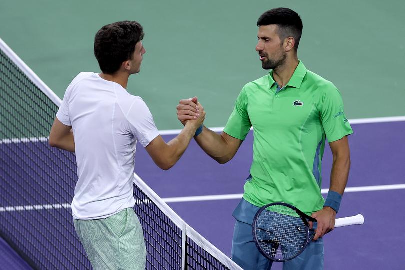 INDIAN WELLS, CALIFORNIA - MARCH 11: Luca Nardi of Italy is congratulated by Novak Djokovic of Serbia after their match during the BNP Paribas Open at Indian Wells Tennis Garden on March 11, 2024 in Indian Wells, California. (Photo by Matthew Stockman/Getty Images)