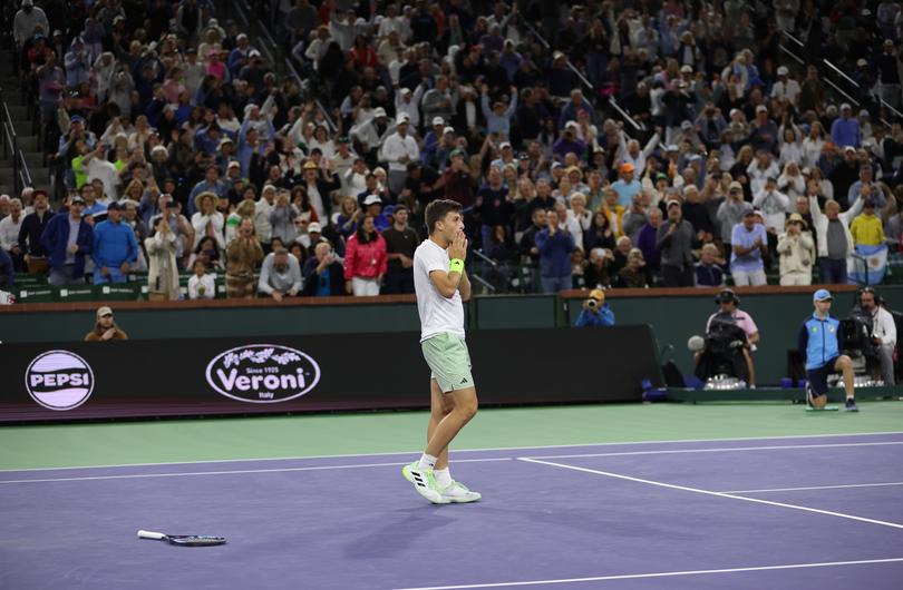 INDIAN WELLS, CALIFORNIA - MARCH 11: Luca Nardi of Italy celebrates match poin against Novak Djokovic of Serbia in their third round match during the BNP Paribas Open at Indian Wells Tennis Garden on March 11, 2024 in Indian Wells, California. (Photo by Clive Brunskill/Getty Images)