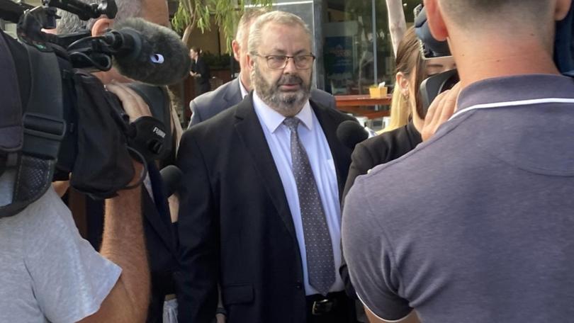 Bus driver Brett Button (centre) outside Newcastle Court House