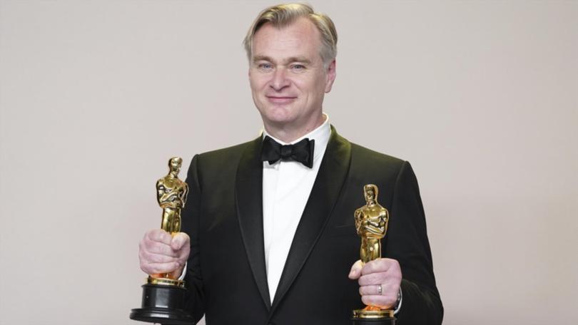 Britain's Christopher Nolan poses with Oscars for best director and best picture for Oppenheimer. (AP PHOTO)