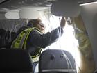 NTSB Investigator-in-Charge John Lovell examines the fuselage plug area of Alaska Airlines Flight 1282.