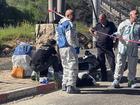 Israeli forces work at the scene of a suspected attack at a checkpoint outside of Jerusalem.