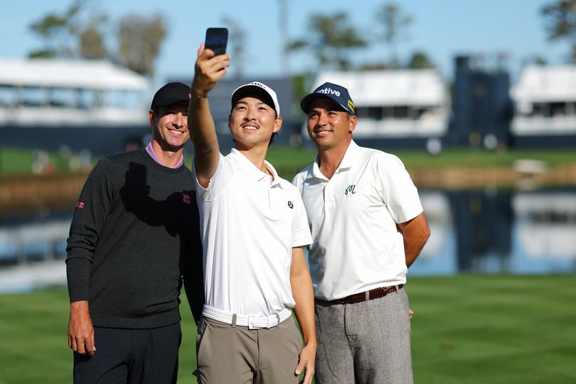 PONTE VEDRA BEACH, FLORIDA - MARCH 12: Min Woo Lee of Australia takes a selfie with Adam Scott of Australia and Jason Day of Australia on the 17th tee prior to THE PLAYERS Championship on the Stadium Course at TPC Sawgrass on March 12, 2024 in Ponte Vedra Beach, Florida. (Photo by Kevin C. Cox/Getty Images)