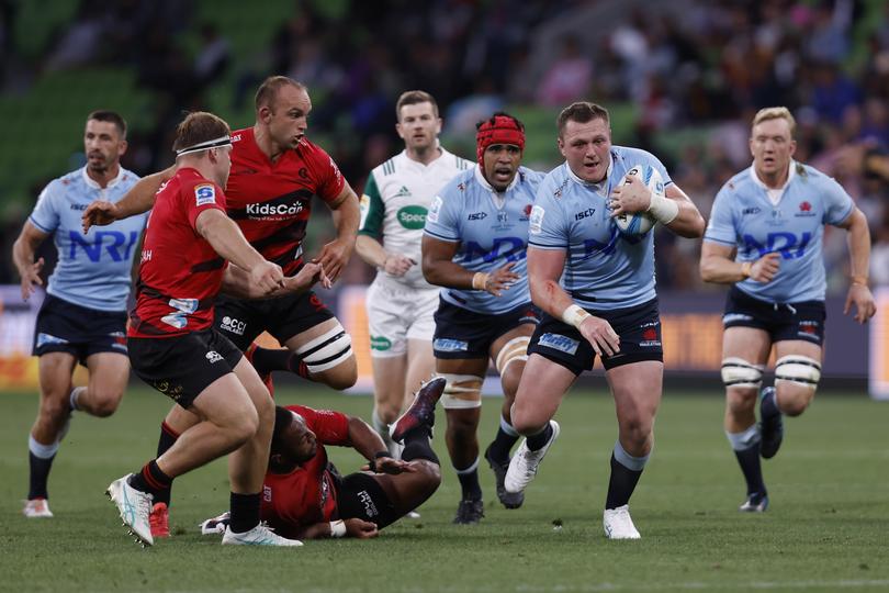MELBOURNE, AUSTRALIA - MARCH 02: Angus Bell of the Waratahs runs with the ball during the round two Super Rugby Pacific match between Crusaders and NSW Waratahs at AAMI Park, on March 02, 2024, in Melbourne, Australia. (Photo by Darrian Traynor/Getty Images)