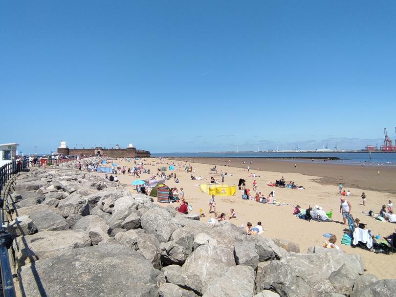 Sea breezes, strolls and beach time make New Brighton a magnet in good weather.