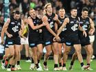 Carlton's Tom de Koning (centre) is congratulated by teammates after a goal against Richmond. (James Ross/AAP PHOTOS)