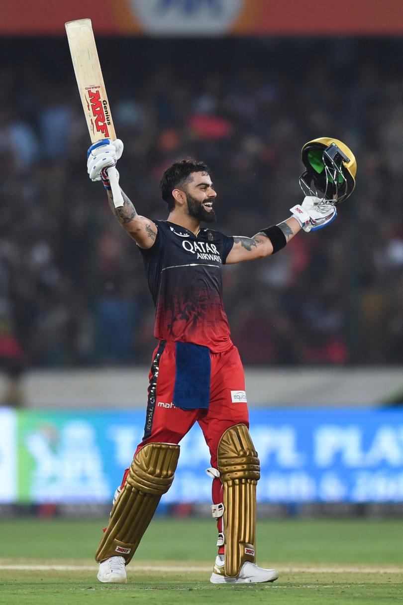 Royal Challengers Bangalore's Virat Kohli celebrates after scoring a century (100 runs) during the Indian Premier League (IPL) Twenty20 cricket match between Sunrisers Hyderabad and Royal Challengers Bangalore at the Rajiv Gandhi International Stadium in Hyderabad.