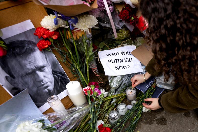 NEW YORK, NEW YORK - FEBRUARY 17: Flowers and signs are placed outside the Russian Consulate for opposition leader and Putin critic Alexei Navalny on February 16, 2024 in New York City.  According to Russian state media, Navalny, the Russian politician and anti-corruption activist who became the most potent voice in opposition to President Vladimir Putin, died during a walk at the IK-3 "Arctic Wolf" penal colony where he was serving a 30 year sentence. (Photo by Michael Nigro/Sipa USA)