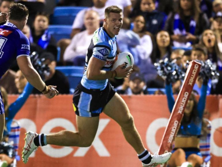 Cronulla's Teig Wilton scores a try during the Sharks' win over the Bulldogs. 