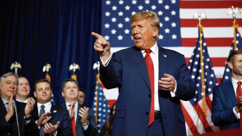 Former President Donald Trump speaks at his caucus night event at the Iowa Events Centre.