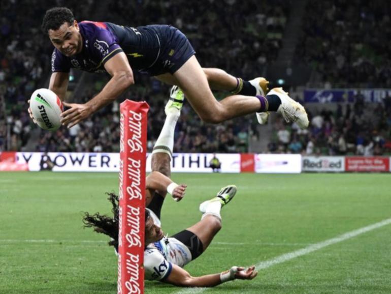 Storm's Xavier Coates flies over for his brilliant match-winning try against the Warriors. (Joel Carrett/AAP PHOTOS)