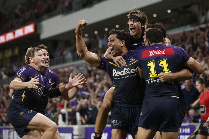 Xavier Coates of the Storm celebrates scoring the match winning try.