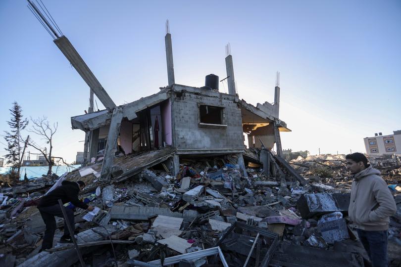 RAFAH, GAZA - MARCH 15 : People inspect damage and recover items from their homes following Israeli air strikes on March 15, 2024 in Rafah, Gaza. The United States and other nations mediating Israel-Hamas ceasefire talks had hoped to reach a temporary truce prior to the start of the Islamic holy month, but recent meetings in Cairo did not produce a result. Meanwhile, the humanitarian situation remains dire in Gaza, with foreign nations proposing new ways to increase aid deliveries, such as the creation of a temporary port. (Photo by Ahmad Hasaballah/Getty Images)