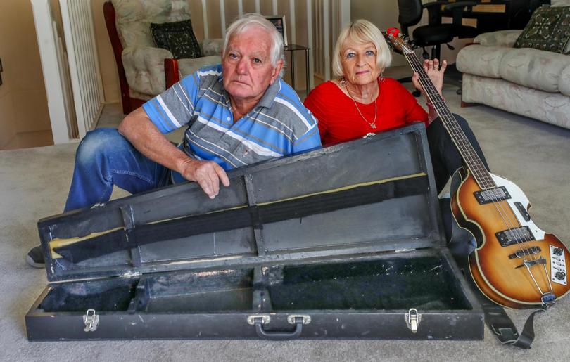 Peter and Judy Bright with a wooden guitar case handmade by Peter. 