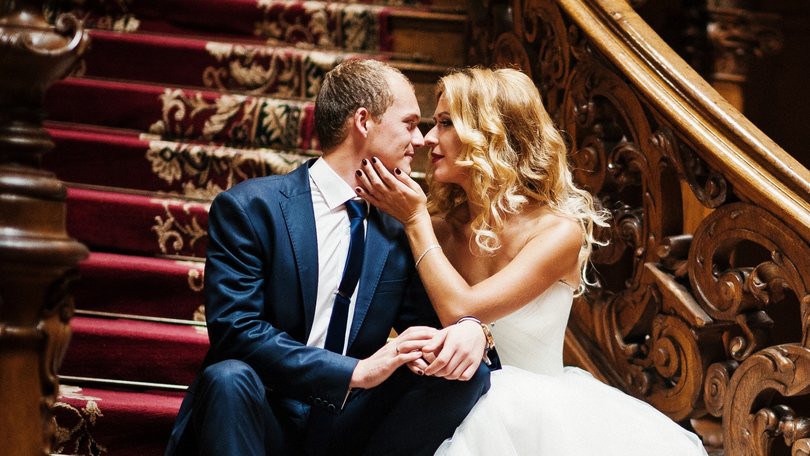 Elegant wedding couple at old vintage house and palace with big wooden stairs