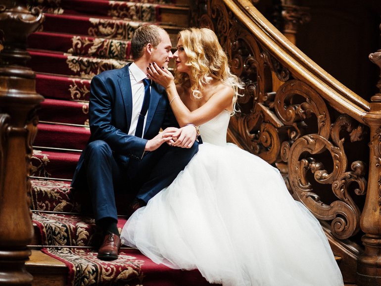 Elegant wedding couple at old vintage house and palace with big wooden stairs
