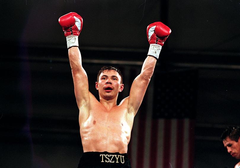 Kostya Tszyu celebrates winning his Superfeather weight title in 1999.