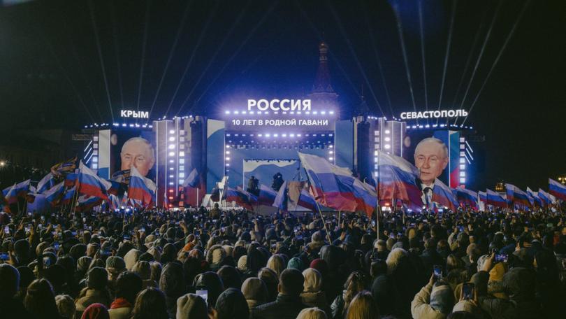 Thousands of Russians gathered on Red Square in Moscow on Monday, a day after Vladimir V. Putin was declared the winner of a stage-managed presidential election.