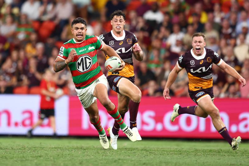 BRISBANE, AUSTRALIA - MARCH 14: Latrell Mitchell of the Rabbitohs makes a break during the round two NRL match between Brisbane Broncos and South Sydney Rabbitohs at Suncorp Stadium, on March 14, 2024, in Brisbane, Australia. (Photo by Chris Hyde/Getty Images)