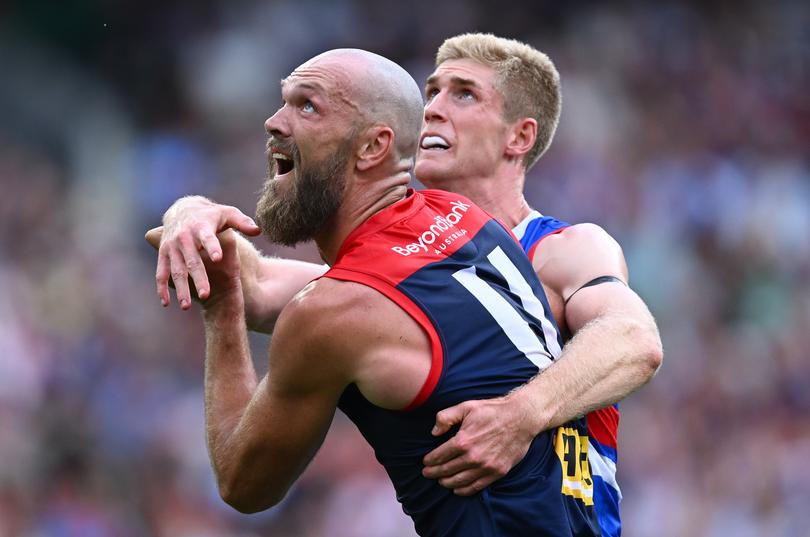 MELBOURNE, AUSTRALIA - MARCH 17: Tim English of the Bulldogs and Max Gawn of the Demons compete in the ruck during the round one AFL match between Melbourne Demons and Western Bulldogs at Melbourne Cricket Ground, on March 17, 2024, in Melbourne, Australia. (Photo by Quinn Rooney/Getty Images)