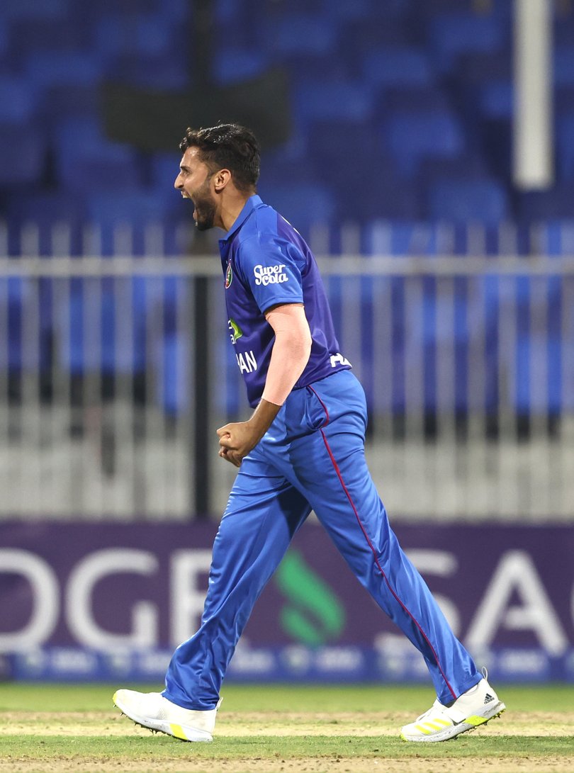 SHARJAH, UNITED ARAB EMIRATES - MARCH 18: Azmatullah Omarzai of Afghanistan celebrates after dismissing Harry Tucker of Ireland during the Men's Twenty20 International match between Afghanistan and Ireland on March 18, 2024 in Sharjah, United Arab Emirates. (Photo by Francois Nel/Getty Images)