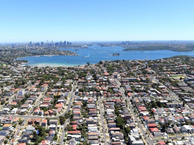 An aerial image shows of eastern suburbs to city skyline in Sydney