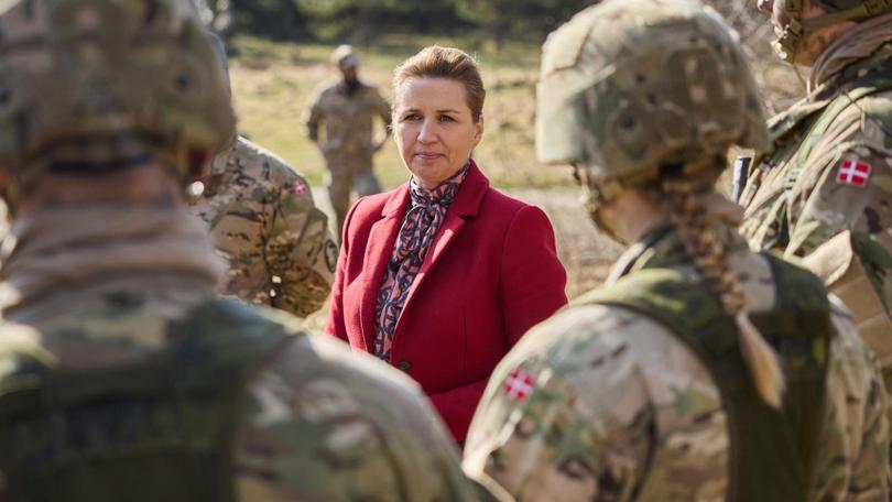 Danish Prime Minister Mette Frederiksen meets conscripts during a visit to Air Base Karup.