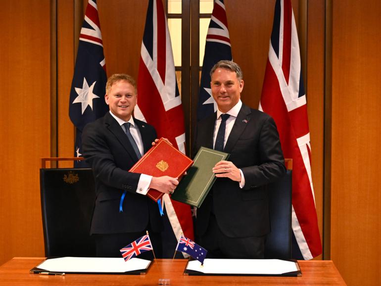 Secretary of State for Defence of the United Kingdom Grant Shapps (left) and Australian Defence Minister Richard Marles.