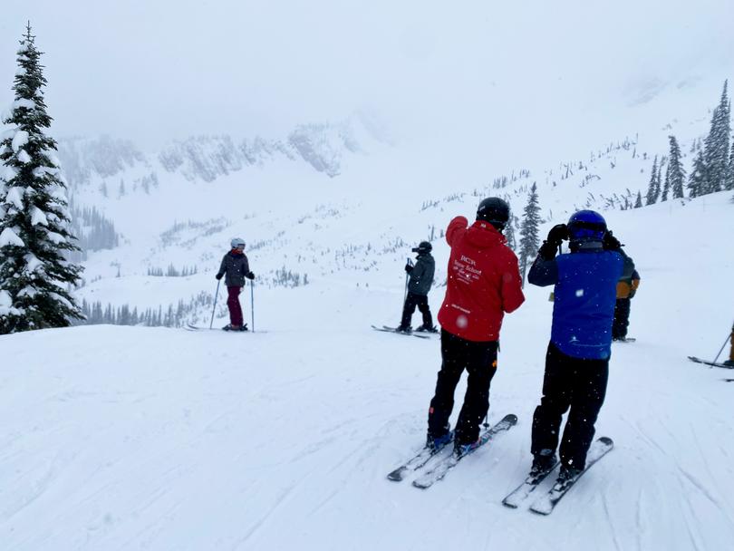  Skiers at Fernie Alpine Resort prepare to descend one of the resort's five massive bowls.