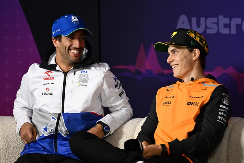 MELBOURNE, AUSTRALIA - MARCH 21: Daniel Ricciardo of Australia and Visa Cash App RB and Oscar Piastri of Australia and McLaren talk in the Drivers Press Conference during previews ahead of the F1 Grand Prix of Australia at Albert Park Circuit on March 21, 2024 in Melbourne, Australia. (Photo by Quinn Rooney/Getty Images)